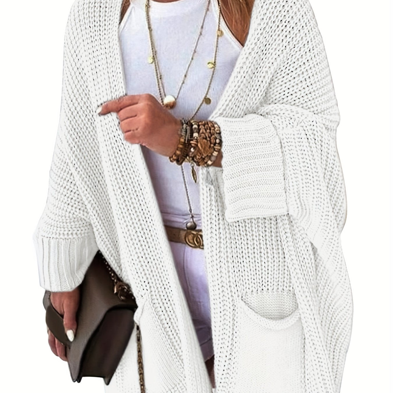 Stay warm and stylish this fall and winter with an elegant mid-length knit cardigan featuring convenient pockets.