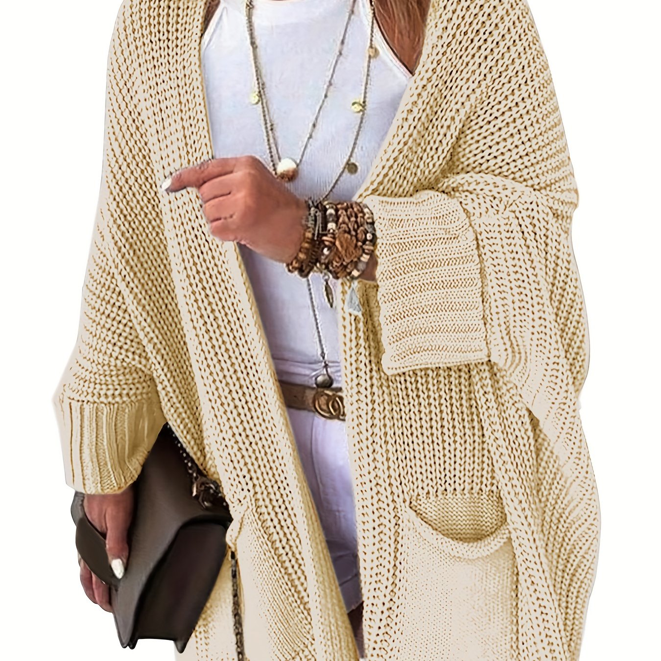 Stay warm and stylish this fall and winter with an elegant mid-length knit cardigan featuring convenient pockets.