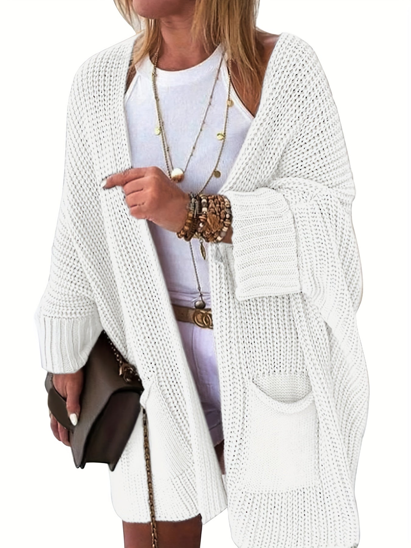 Stay warm and stylish this fall and winter with an elegant mid-length knit cardigan featuring convenient pockets.