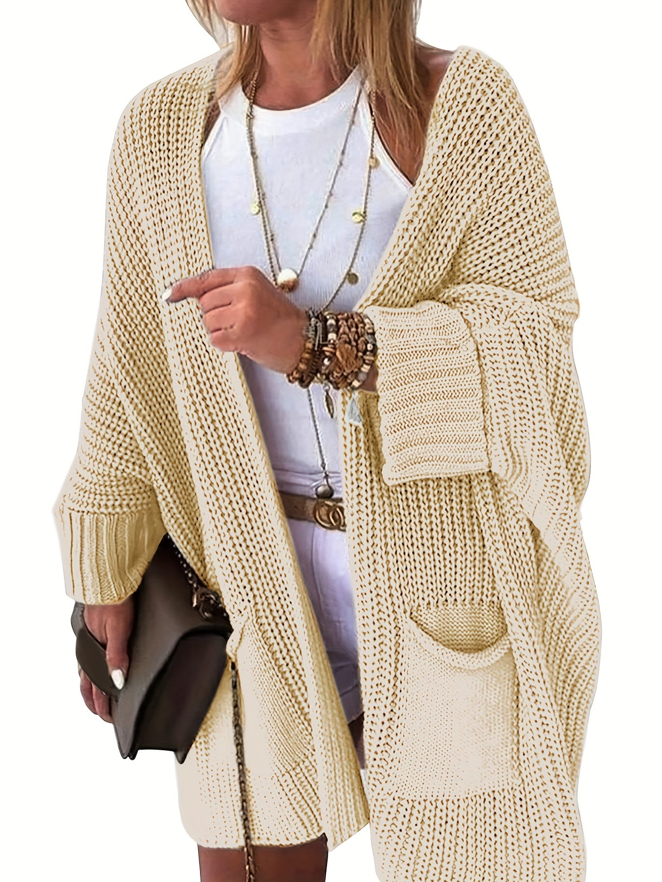 Stay warm and stylish this fall and winter with an elegant mid-length knit cardigan featuring convenient pockets.