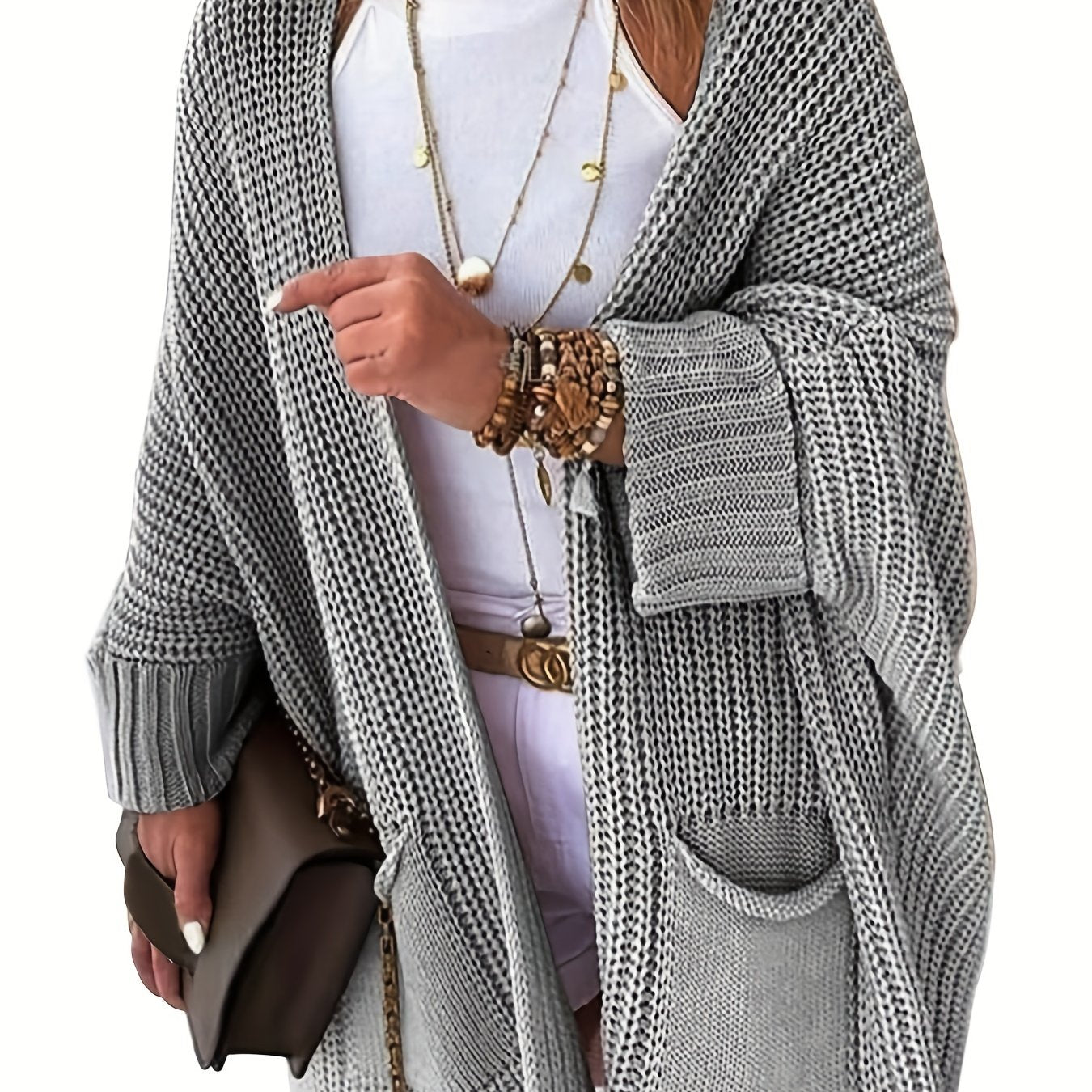 Stay warm and stylish this fall and winter with an elegant mid-length knit cardigan featuring convenient pockets.