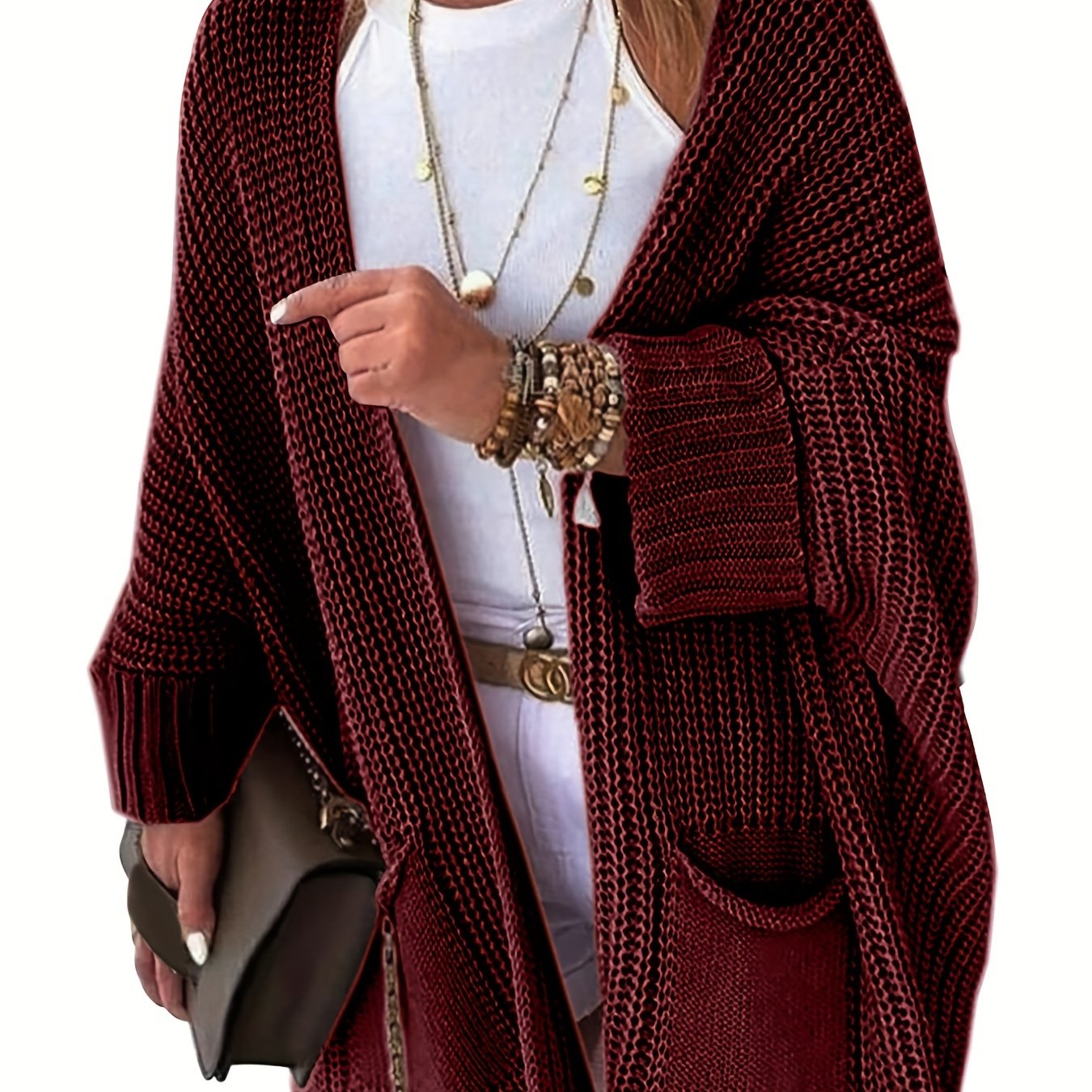 Stay warm and stylish this fall and winter with an elegant mid-length knit cardigan featuring convenient pockets.