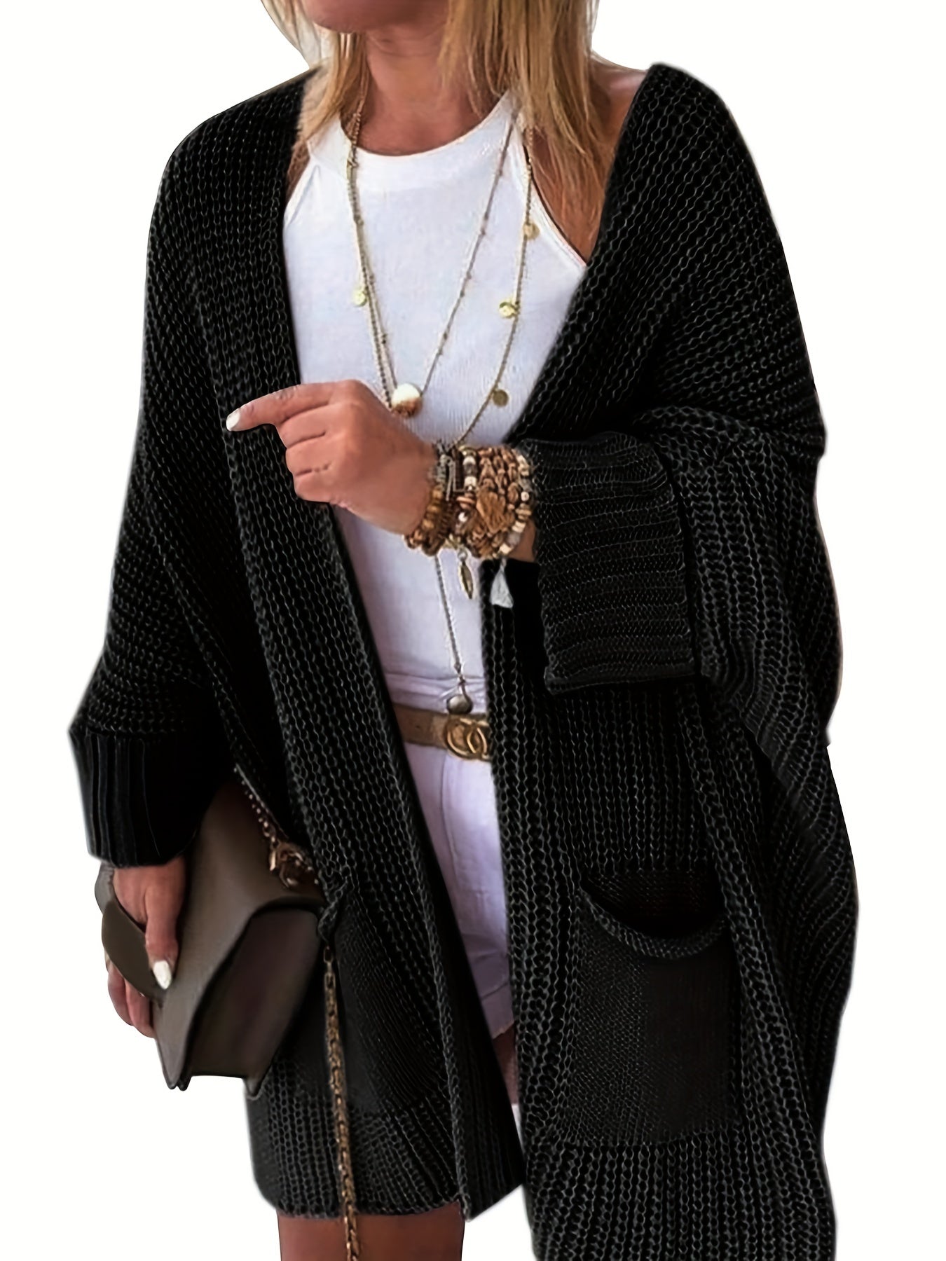 Stay warm and stylish this fall and winter with an elegant mid-length knit cardigan featuring convenient pockets.