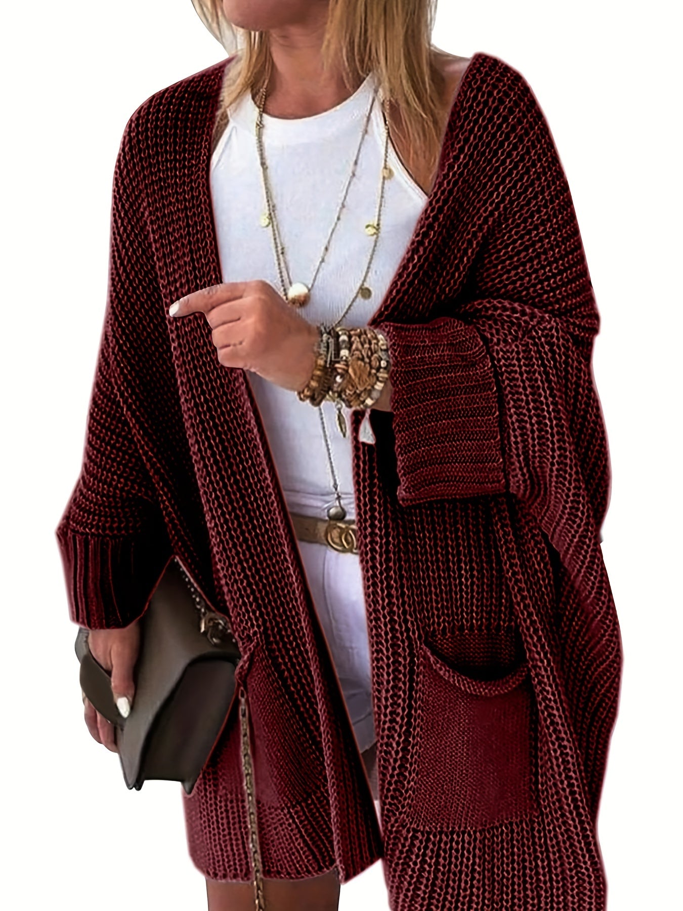 Stay warm and stylish this fall and winter with an elegant mid-length knit cardigan featuring convenient pockets.
